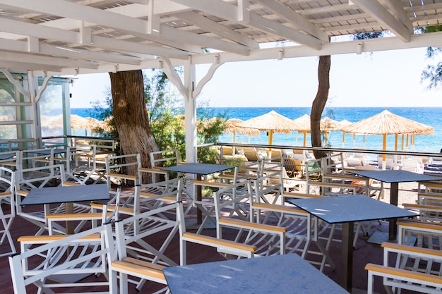 Restaurant terrace in front of the beach in kamari on the island of santorini