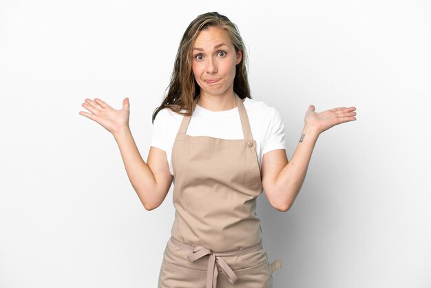 Restaurant waiter caucasian woman isolated on white background having doubts while raising hands