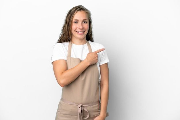 Restaurant waiter caucasian woman isolated on white background pointing to the side to present a product