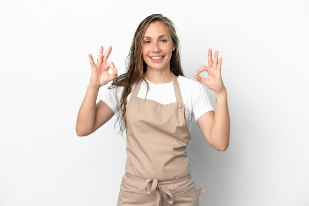 Restaurant waiter caucasian woman isolated on white background showing an ok sign with fingers