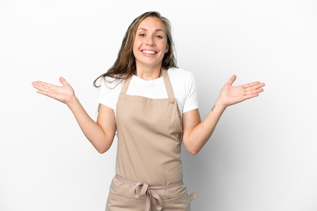 Restaurant waiter caucasian woman isolated on white background with shocked facial expression