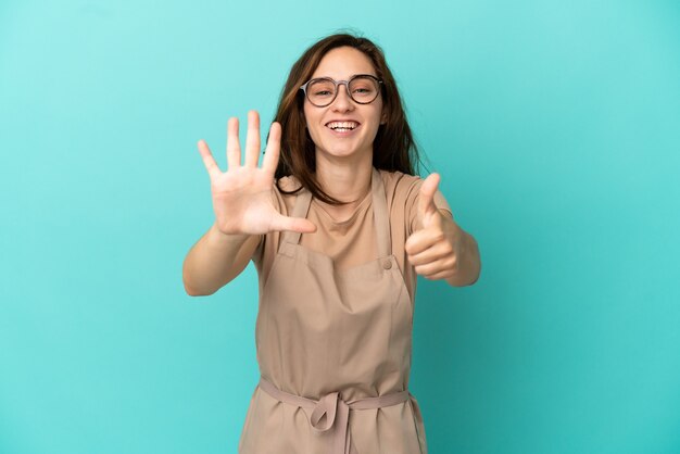 Restaurant waiter counting six with fingers