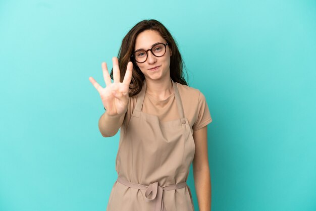 Photo restaurant waiter happy and counting four with fingers