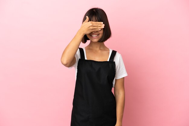 Restaurant waiter over isolated pink background covering eyes by hands. Do not want to see something