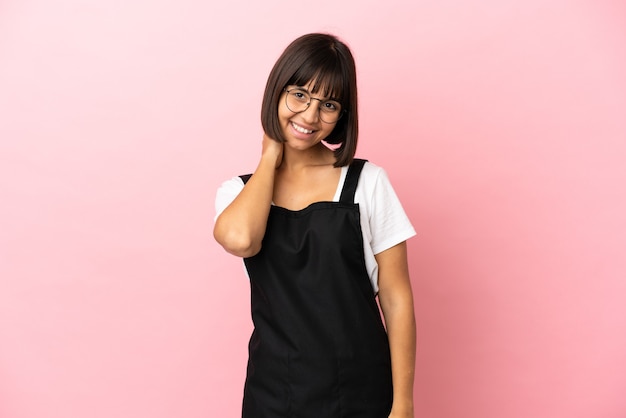 Restaurant waiter over isolated pink background laughing