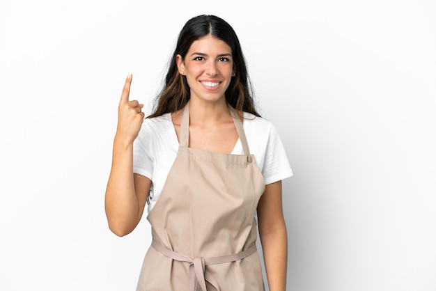 Restaurant waiter over isolated white background pointing with the index finger a great idea