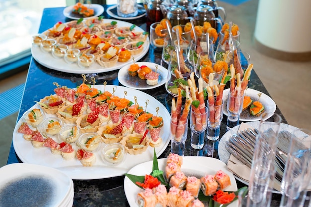 A restaurant waiter serves an offsite banquet in the officexA