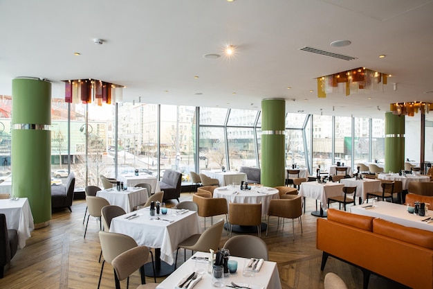 restaurant and white table with empty glasses set in restaurant catering food table