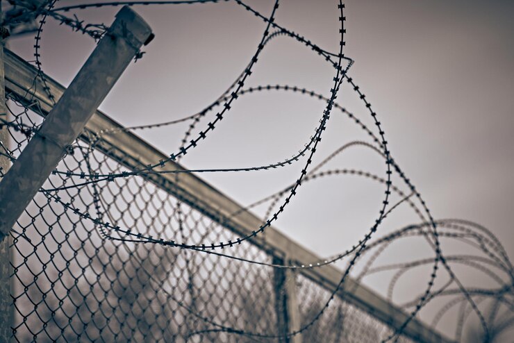 Restricted area barbed fence security measures for prisoners classified state zone