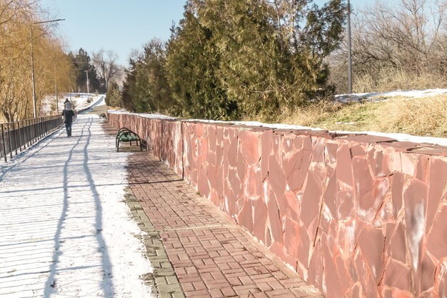 Retaining wall made of natural stone in the city park