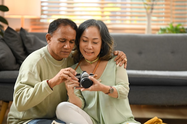 Retired couple packing cloth and stuff getting ready for their trip Traveling in retirement concept