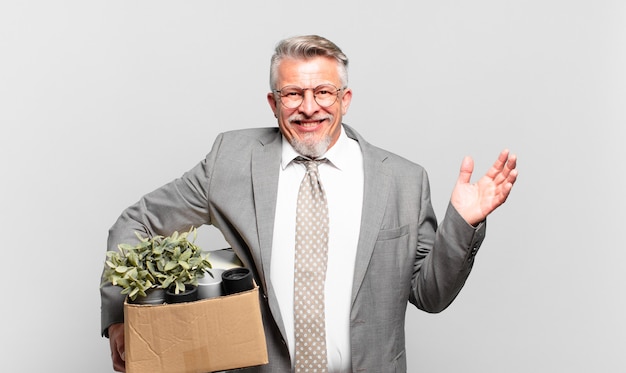 Retired senior businessman feeling happy, surprised and\
cheerful, smiling with positive attitude, realizing a solution or\
idea