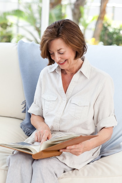 Retired woman reading her book