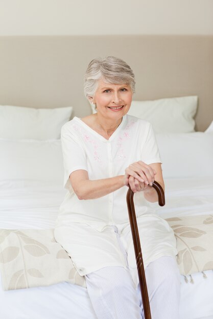 Retired woman with her walking stick 