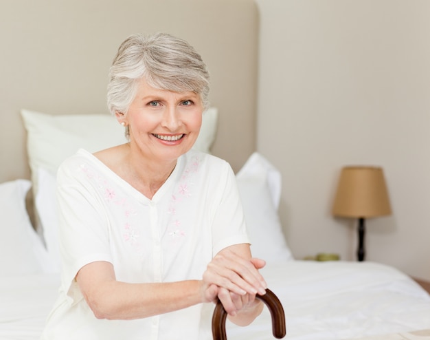 Retired woman with her walking stick 