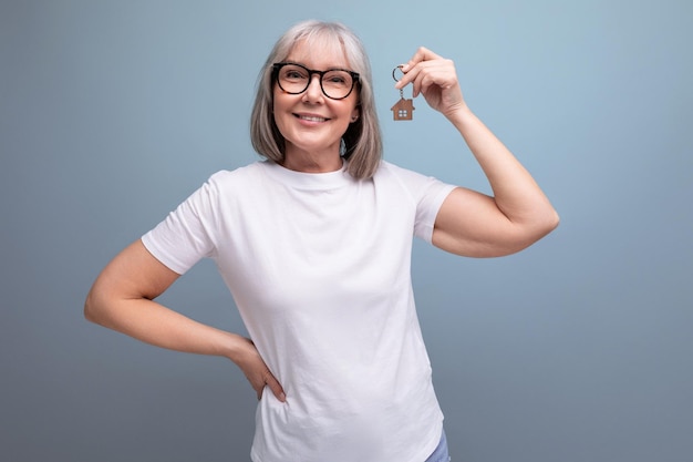 Retirement business mature woman holding real estate keys