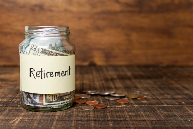 Retirement label on a jar filled with money and copy space