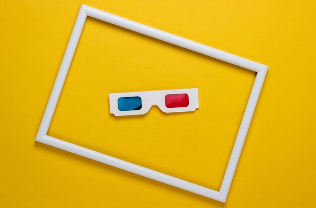 Retro 80s paper stereo 3D glasses with red-blue eye filters on yellow background with white frame. Concept art