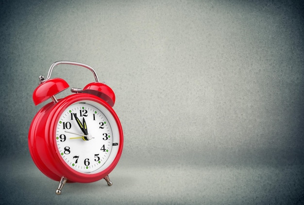 Retro alarm clock on table  background