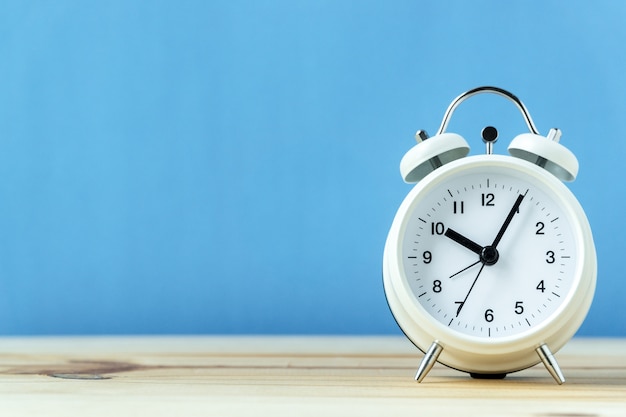 retro alarm clock on wood table