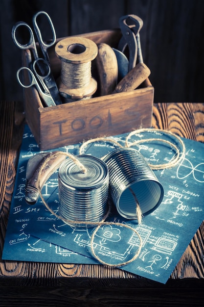 Retro analog telephone made of cans and string