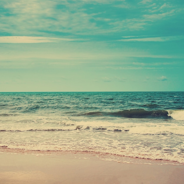 Retro beach and blue sky with vintage tone.