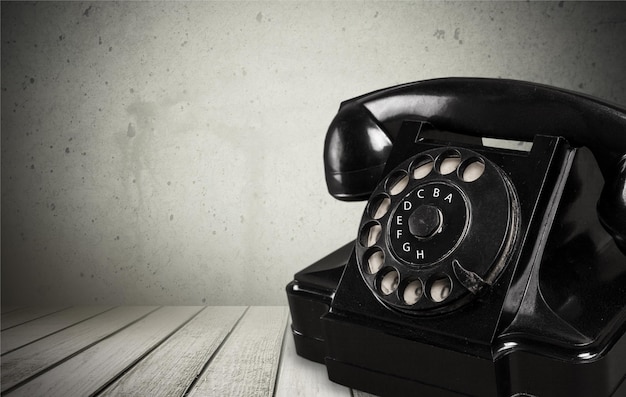 Retro black telephone on  background