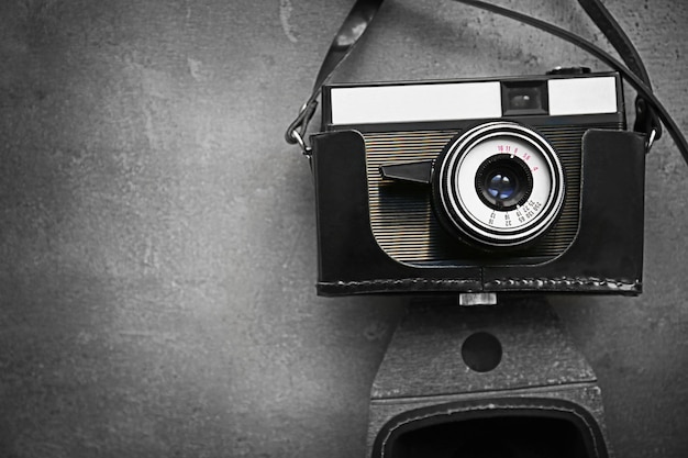 Photo retro camera on grey textured background