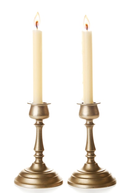 Photo retro candlesticks with candles isolated on white