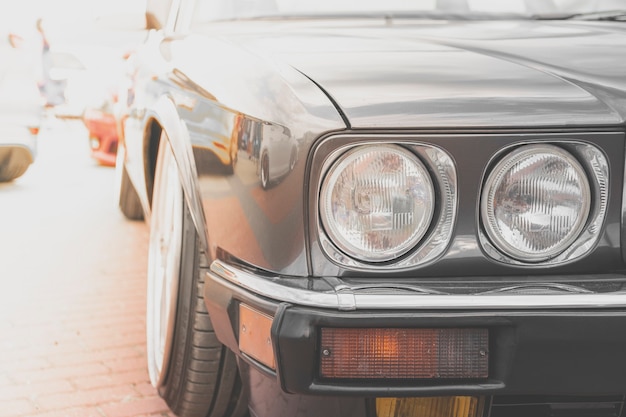 Retro car headlight. Old vintage car automobile front side with round lights.