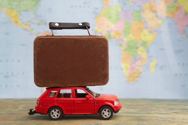 Retro car with suitcases on map. Summer vacation concept