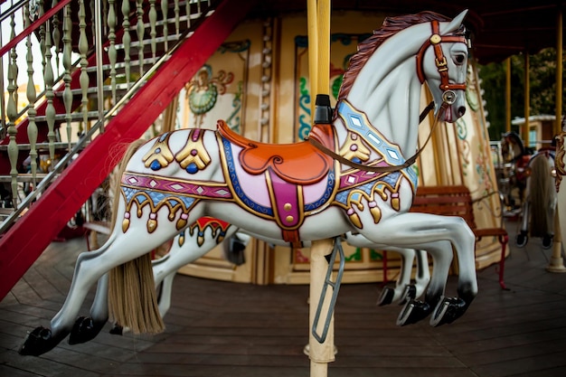 Retro carousel white black horse Old wooden horse carousel Carousel Horses on vintage