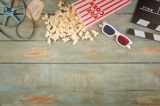 Retro cinema objects on wooden background