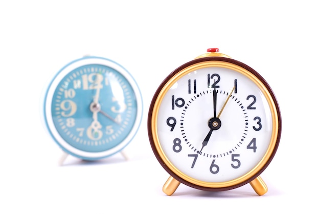 Retro clock isolated on white background Close up