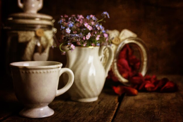 Retro effect on photo vintage tea with rose dry petal