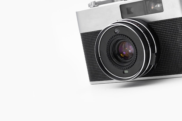 Retro film camera on an isolated white background