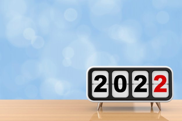 Flip clock retrò con segno di capodanno 2022 su un tavolo di legno. rendering 3d