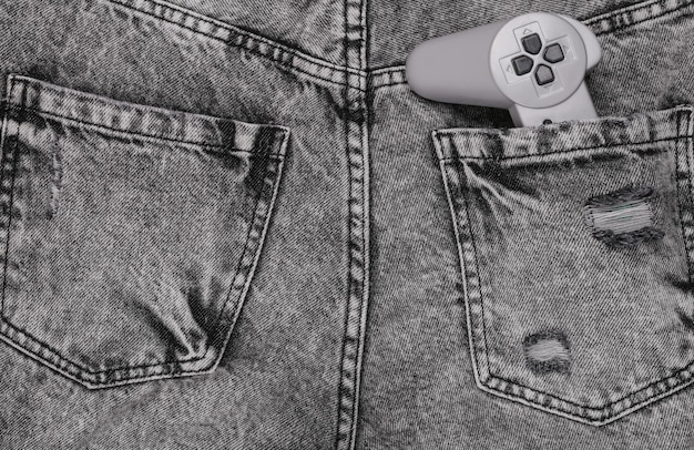 Retro gamepad in achterzak van grijze jeans