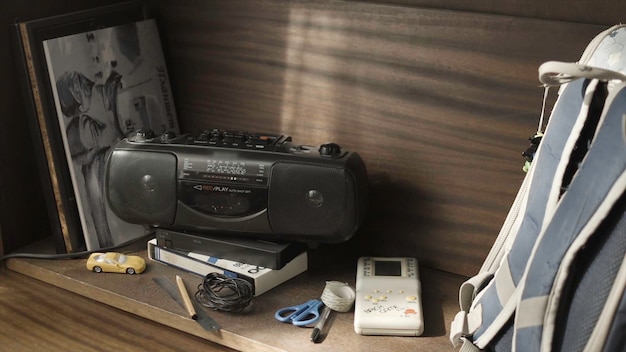 Retro ghetto blaster cassette tape recorder on table vintage radio boombox on dark background old