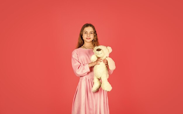 Retro girl play with bear toy happy childhood gift for birthday holiday best present ever valentines day kid at toy shop feeling carefree and cosy small girl hold teddy bear