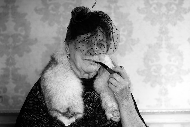 Retro grandmother smoking black and white photo