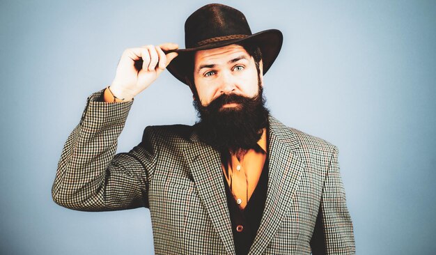 Retro handsome man portrait face of serious bearded hipster with vintage hat Vintage fashion vogue