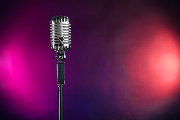 Photo retro microphone on colorful blurred background