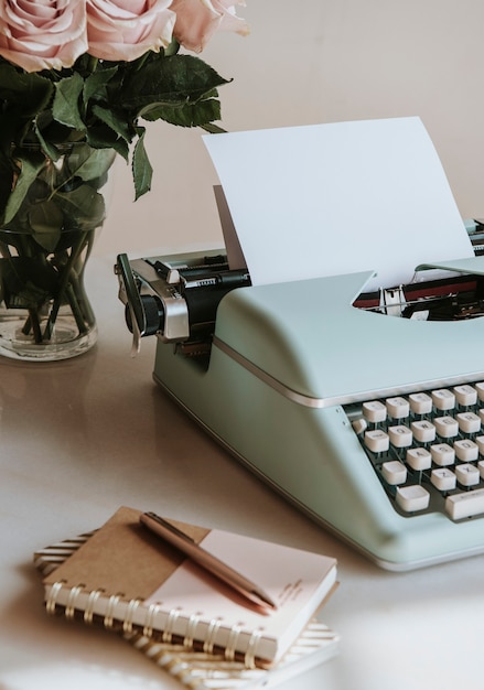 Retro mint typewriter by pink roses