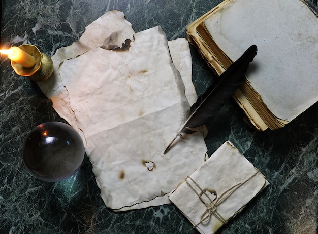 Retro papers and book on a table with detective tools background