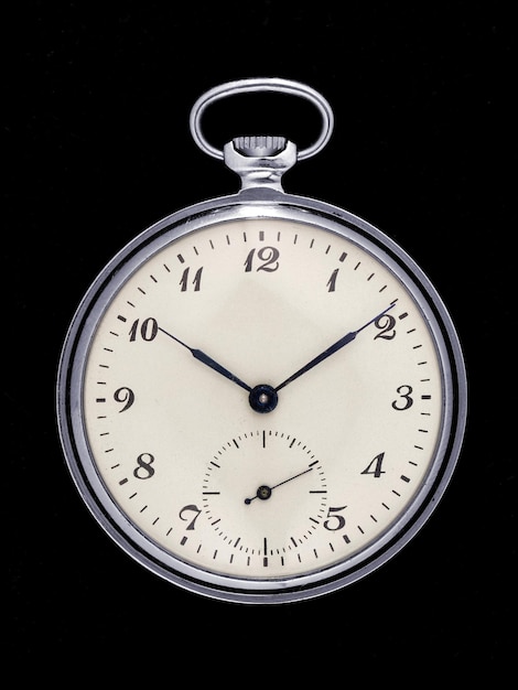retro pocket watch isolated on black background front view