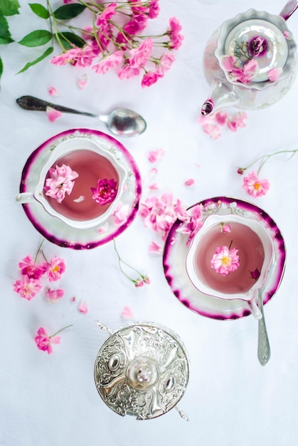 Retro porcelain cup of hot rose tea