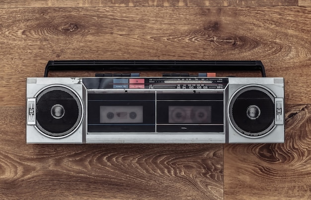 Retro radio audio tape recorder on a wooden floor. top\
view