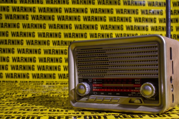 Retro radio on background keep out distance warning sign