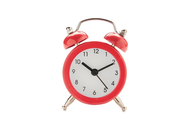 Retro red alarm clock isolated on white background